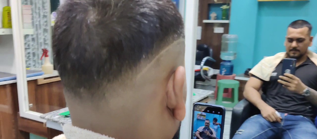 A precision fade in progress at Crown Saloon